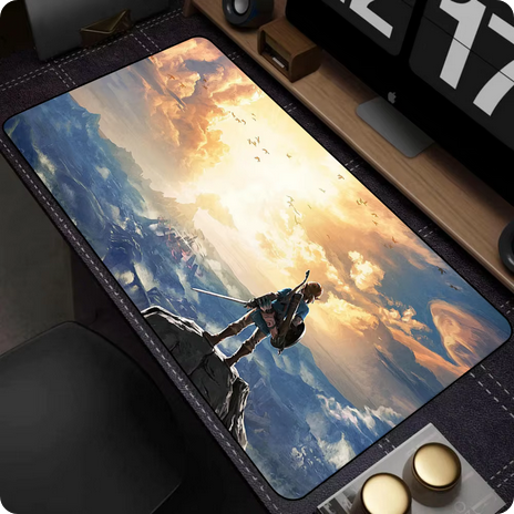 A Legend of Zelda theme mouse pad laid on a modern computer desk.