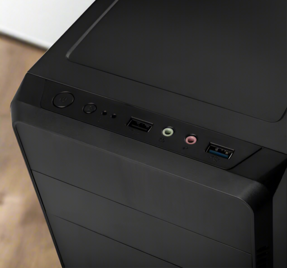 top view of a black computer case with a living room in the background