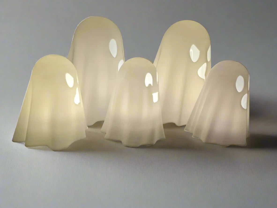 a set of five ghost tealight candles seen from the side